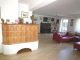 Wohnen auf einer Ebene! 
Wohnhaus mit Einliegerwohnung in Kirchham - Wohnen - Kachelofen